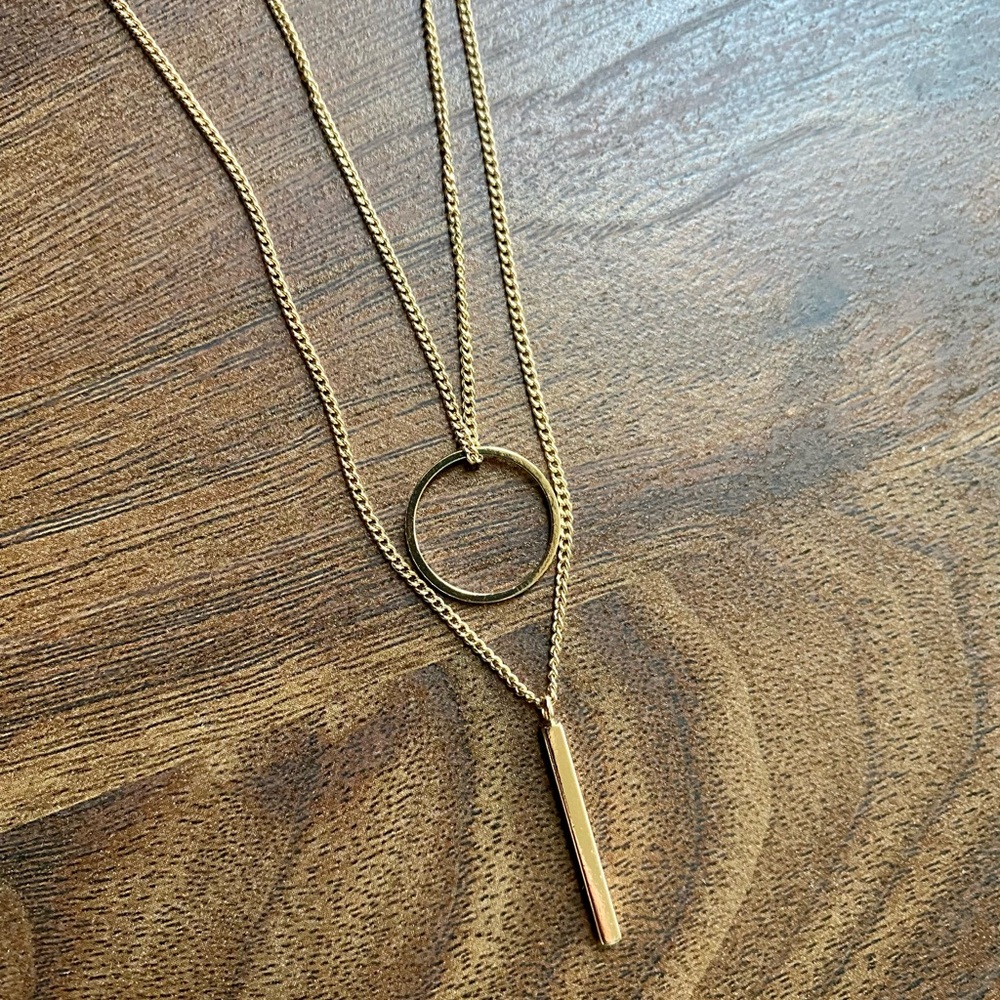Gold double strand necklace with gold circle and gold bar